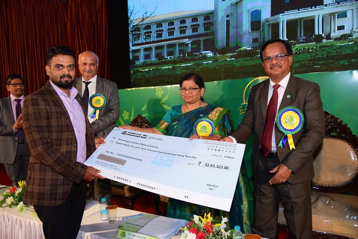 Corporation Bank MD and CEO P V Bharathi handS over cheque under CSR activity to Shivamogga Institute of Medical Sciences towards three haemodialysis machines during the 114th Foundation Day celebrations of the Bank in Mangaluru on Tuesday.