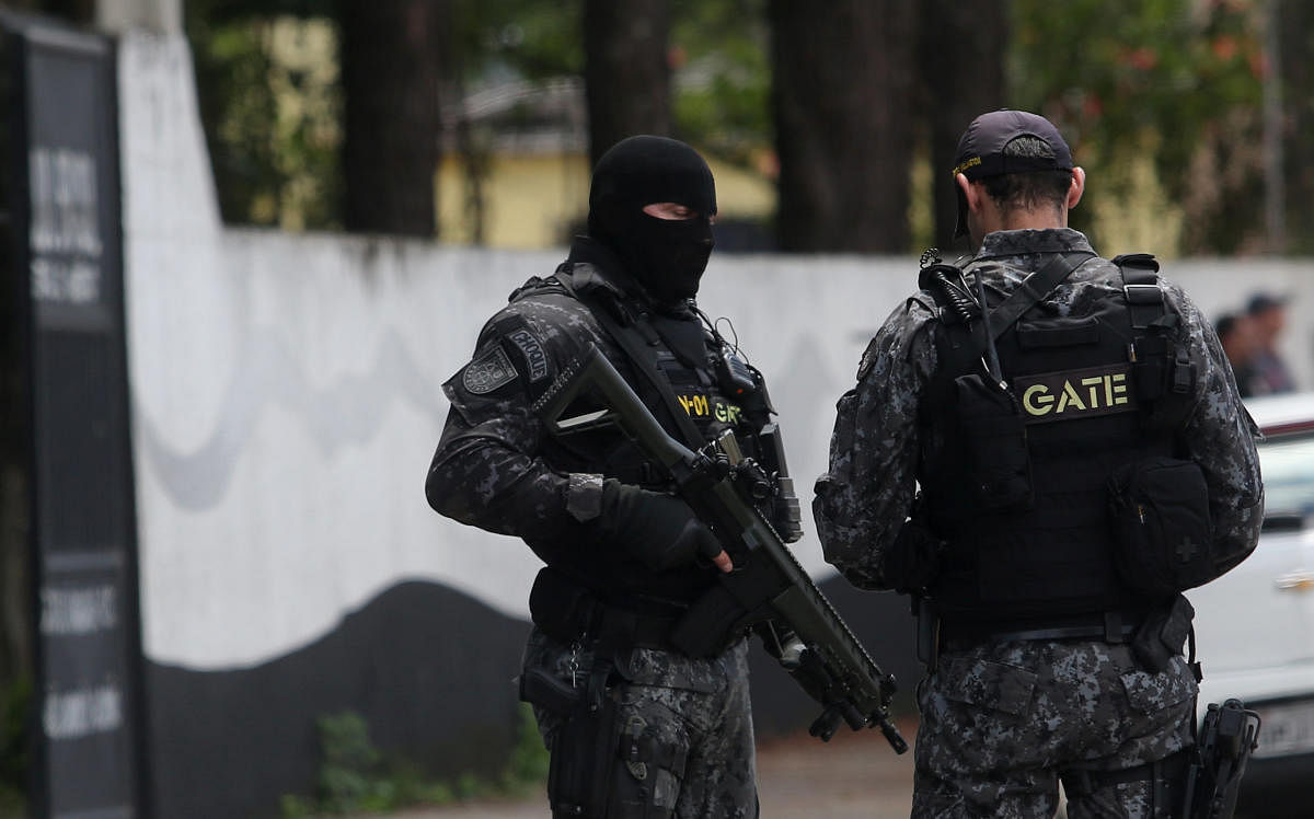Policemen are seen at the Raul Brasil school after a shooting in Suzano, Sao Paulo state, Brazil March 13, 2019. REUTERS/Amanda Perobelli