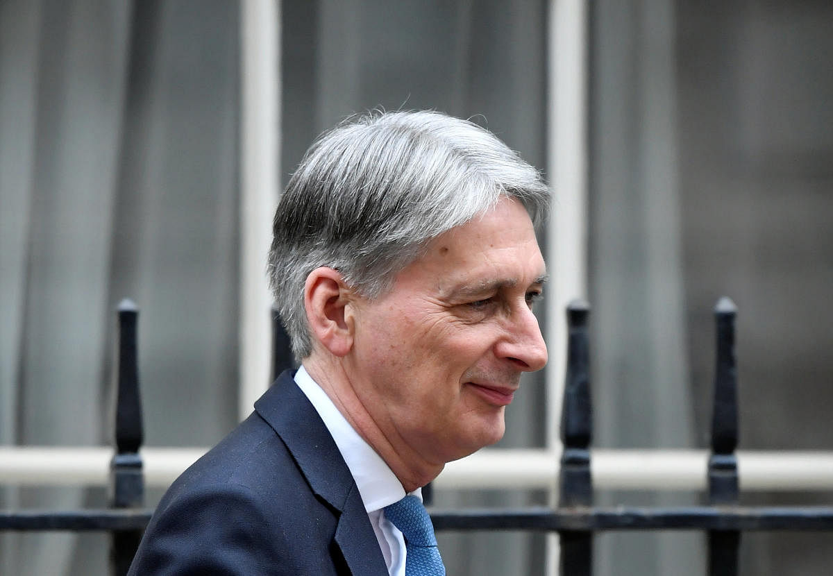"Last night's vote leaves a cloud of uncertainty hanging over our economy and... our most urgent task in this House is to lift that uncertainty," Hammond said in his budget address. (Reuters Photo)