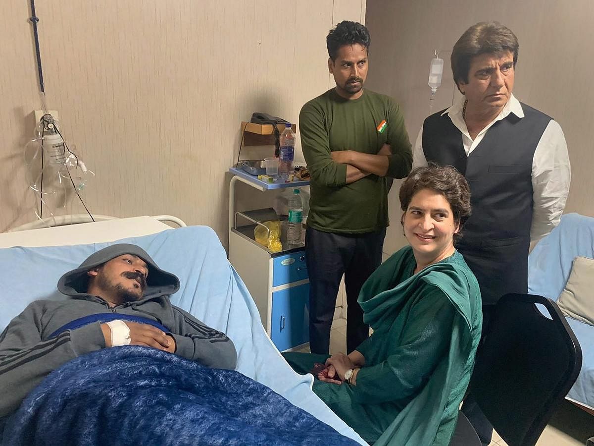 Congress general secretary Priyanka Gandhi Vadra visits Bhim Army chief Chandrashekhar Azad at a hospital, in Meerut on Wednesday. PTI