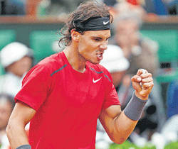 Rafael Nadal celebrates after winning a point during the French Open final against Novak Djokovic on Sunday. AFP