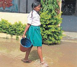 A student is engaged in cleaning work at a government school in the City. DH Photo
