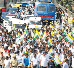 HURDLE: The rally by KJP workers hamperedsmoothmovement of traffic in Bangalore on Wednesday. DH PHOTO