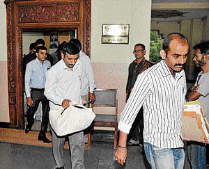 weight of evidence: Sleuths of the Lokayukta police take  possession of documents at the office of the Commissioner for Kannada and Culture in the City on Monday. dh photo