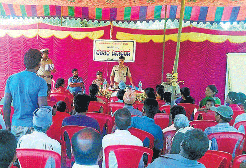 SP Ravi D Channanavar speaks at a public interaction programme, organised by Police department, at Athihalli in Sakleshpur taluk. dh photo