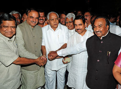 BJP leaders greet former CM BS Yeddyurappa as he rejoins the party. DH photo