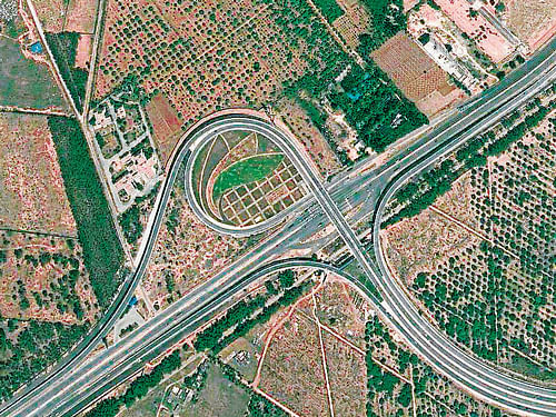 The trumpet intersection linking Airport road with the approach road to Kempegowda International Airport (KIA). Photo Coutesy: Google Earth