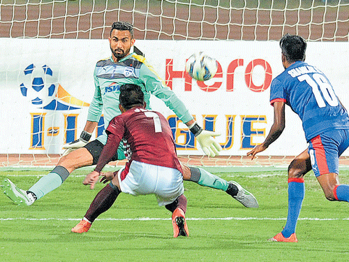 On target: Mohun Bagan's striker Jeje Lalpekhlua (centre) scores the first goal for his team against Bengaluru FC in their I- League encounter on Saturday. DH Photo/ Srikanta sharma r
