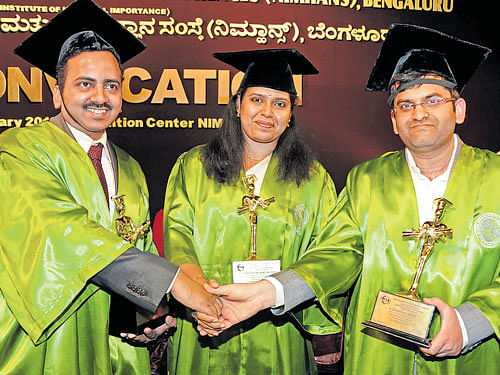 Awardees (from left) Dr Suhas G (outgoing student in MD psychiatry), Dr Manasa S Seshadri, (best outgoing student in Diploma in Psychiatry) and Dr Mohit Mittal (best outgoing student in DM Neuroanaesthesia) greet each other at the 20th convocation of Nimhans in the City on Saturday. DH PHOTO