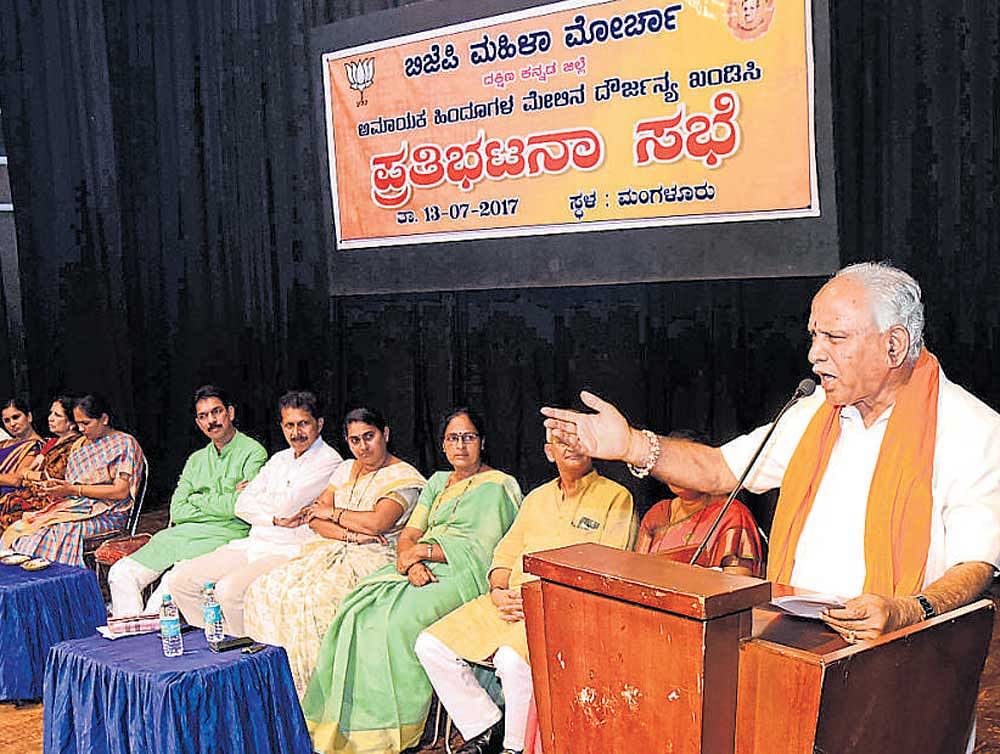 BJP&#8200;state president B S&#8200;Yeddyurappa speaks at the protest meet organised by BJP&#8200;Mahila Morcha at Town Hall in Mangaluru on Thursday. Dh Photo