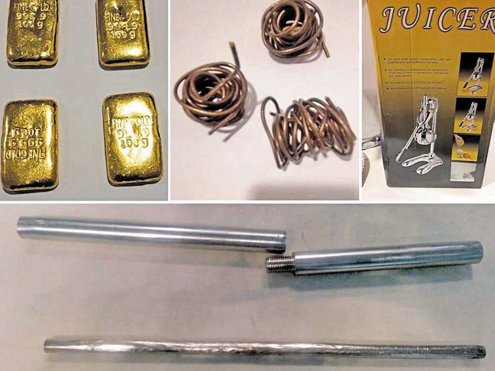 Gold biscuits found concealed in undergarment of a woman seized at Kempegowda International Airport; yellow metal hidden in wires; it was converted into a rod and placed in hollow of the juicer's support stand.