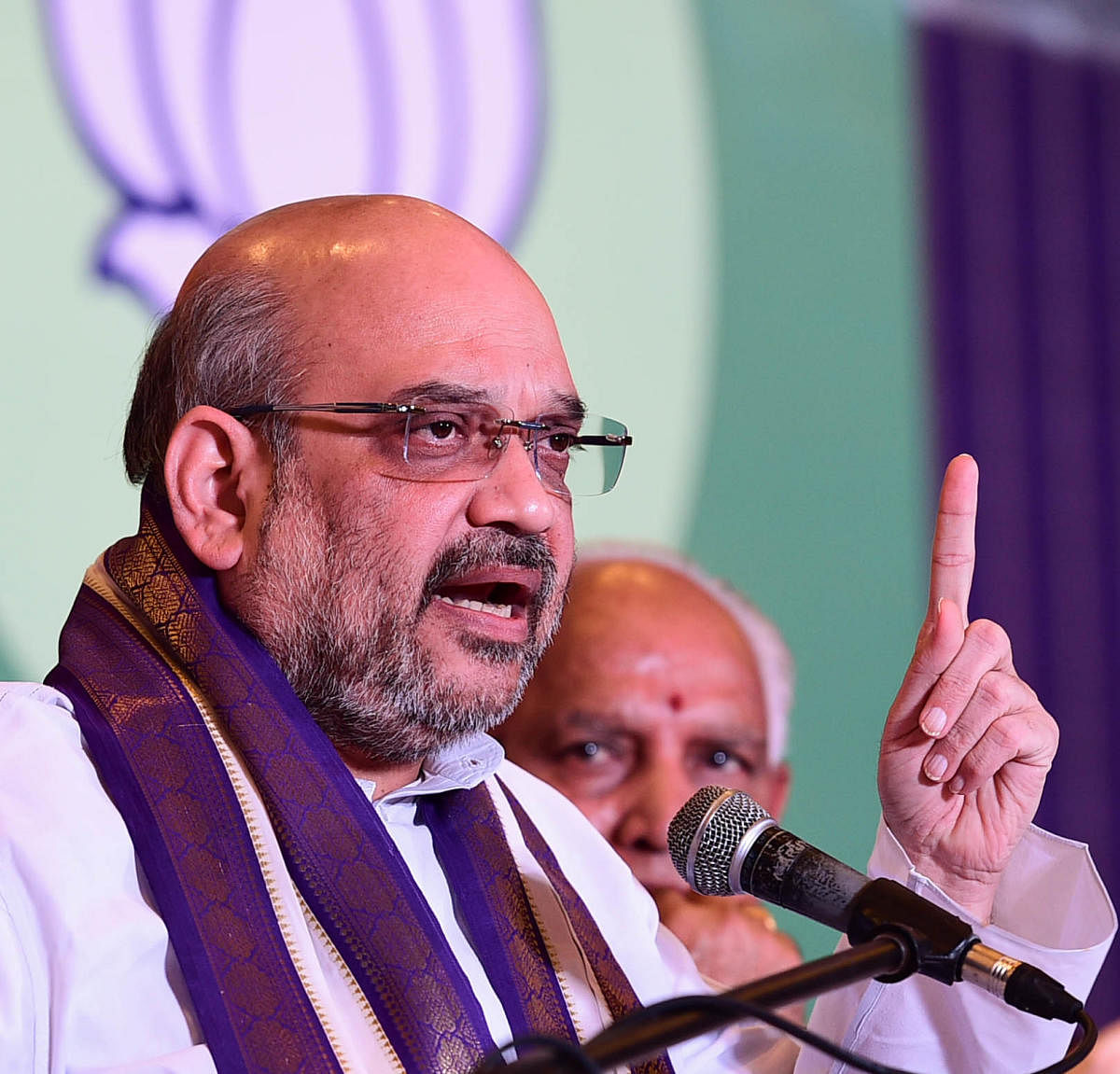 At the meeting to review the poll preparedness of the state unit of the BJP in Bengaluru on Sunday, Amit Shah appreciated the efforts behind the Nava Karnataka Nirmana Parivarthana Yatra, but is said to have directed B S Yeddyurappa not to name any candidates. DH File Photo