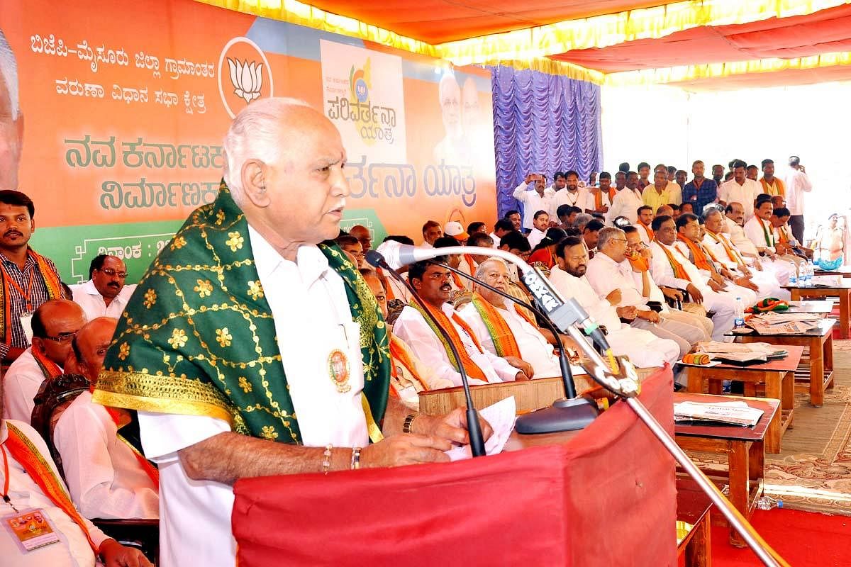 BJP state president B S Yeddyurappa addresses a gathering during the Parivartana Yathre, at Suttur, in Nanjangud taluk, on Tuesday.
