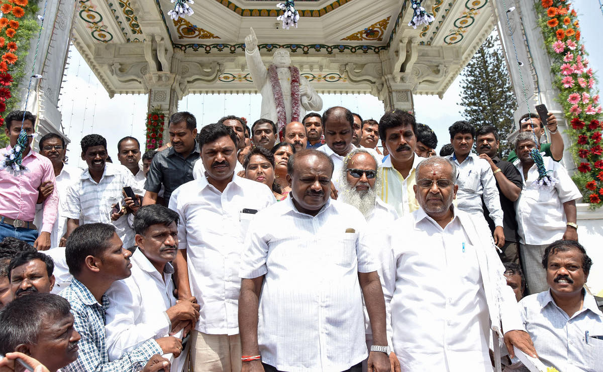 JD(S) State President H D Kumarswamy, MLA G T Devegowda along with JD(S) Party members celebration the Dr B R Ambedkar 127th Birth, at Town Hall in Mysuru on Saturday. DH photo.