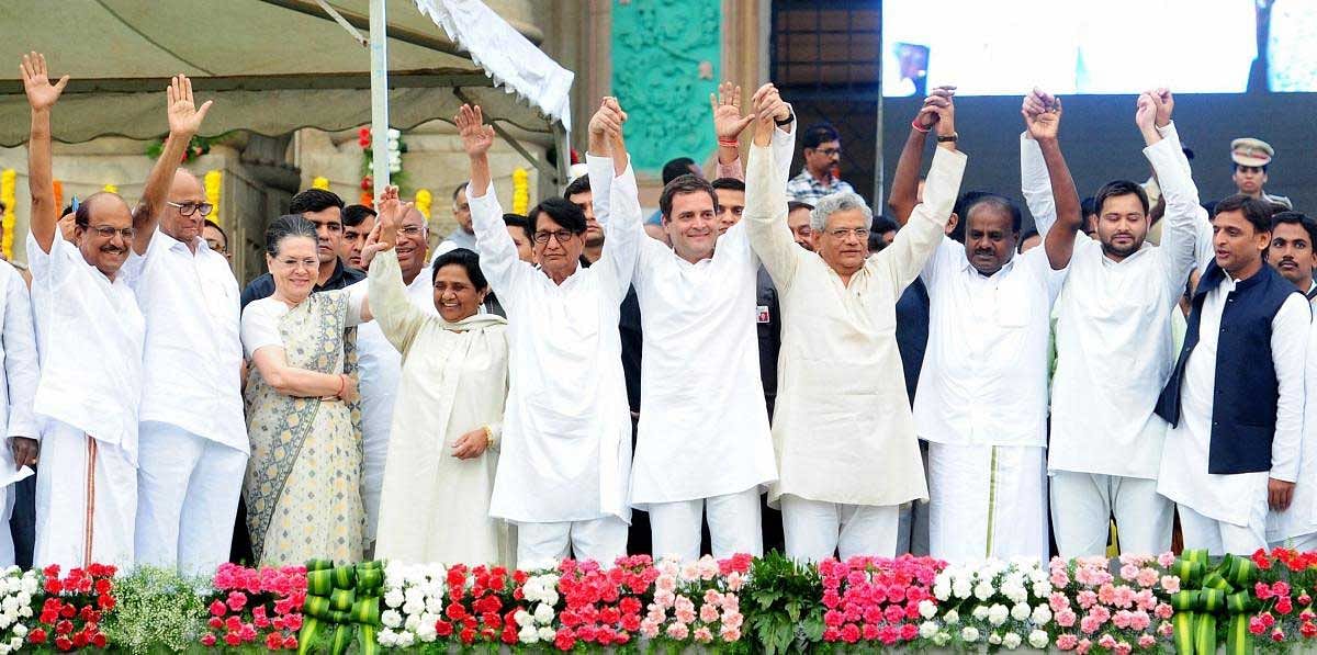  Newly sworn-in Karnataka Chief Minister H D Kumaraswamy with Congress President Rahul Gandhi, Bahujan Samaj Party (BSP) leader Mayawati, Congress leader Sonia Gandhi, Samajwadi Party (SP) leader Akhilesh Yadav, RJD leader Tejashwi Yadav, Communist Party of India (Marxist) General Secretary Sitaram Yechury and others during the swearing-in ceremony, in Bengaluru, on Wednesday. PTI Photo