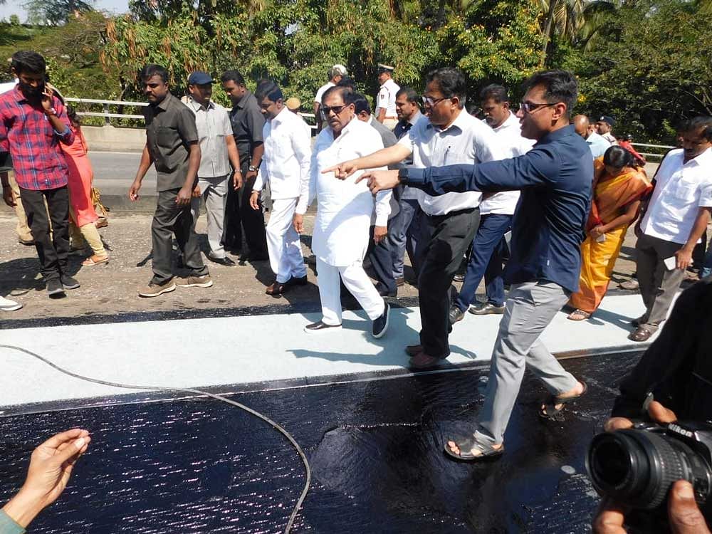 Inspecting the ongoing maintenance work on Tuesday, Deputy Chief Minister G Parameshwara said that the new method has been adopted by the civic body to ease the process of asphalting. DH Photo 