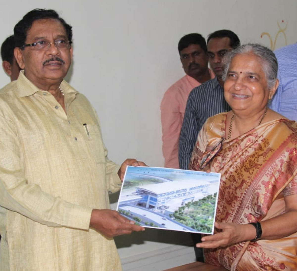 Infosys Foundation chairman Sudha Murthy presents a sketch of the upcoming metro station to Deputy Chief Minister G Parameshwara on Monday.