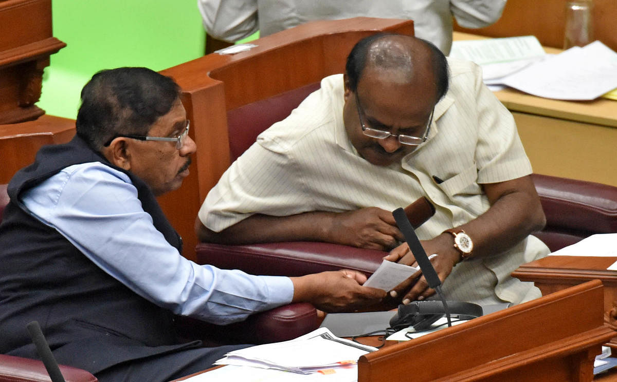 CONSULTATION TIME: Chief Minister H D Kumaraswamy and Deputy Chief Minister G Parameshwara share a word during the Assembly session at Suvarna Vidhana Soudha in Belagavi on Tuesday. DH Photo/M SManjunath