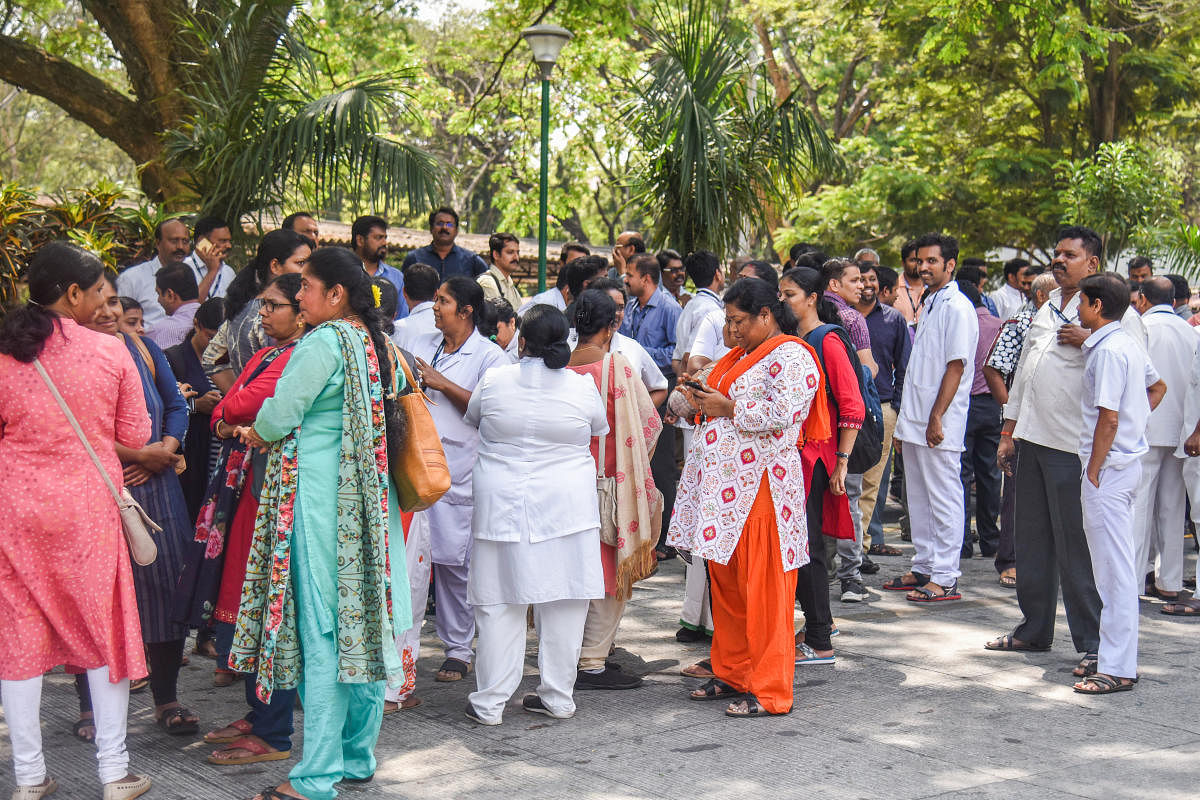 NIMHANS Staff gather infront of Directors office with Various demands pertaining recruitment and promotions at NIMHANS in Bengaluru on Friday. Photo by S K Dinesh