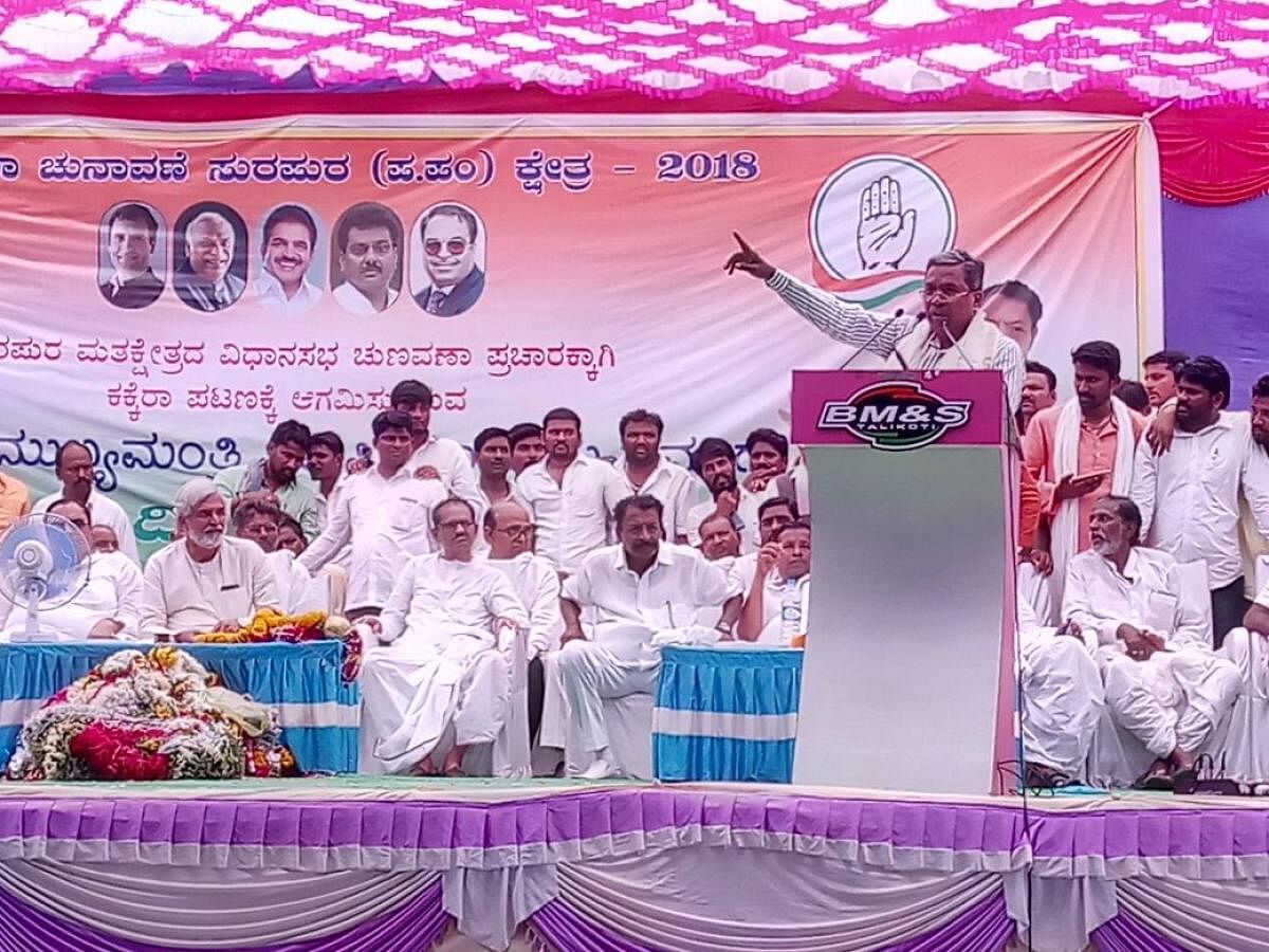 Chief Minister Siddaramaiah addresses a rally at Kakkera village in Yadgir district on Monday. DH Photo
