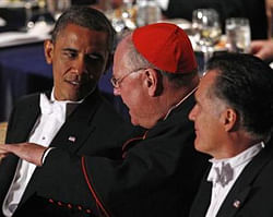 Cardinal Timothy Dolan (C) speaks to U.S. President Barack Obama as U.S. Republican presidential nominee and former Massachusetts Governor Mitt Romney looks on at the Alfred E. Smith Memorial Foundation dinner in New York, October 18, 2012.  Credit: Reuters