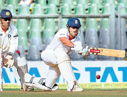 England skipper Alastair Cook sweeps one to the fence during his unbeaten knock of 87 in Mumbai on Saturday. PTI