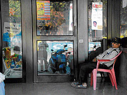 Banking establishments have sought permission from the government for hiring armed guards at ATMs.   DH file photo