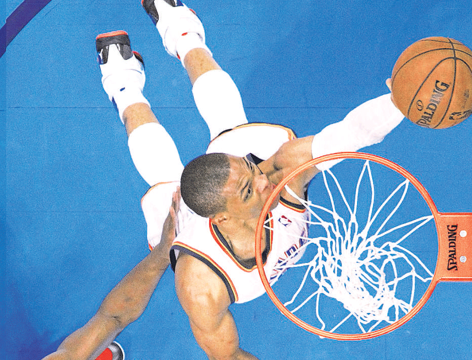 FLYING HIGH:&#8200;Oklahoma City Thunders Russell Westbrook (right) shoots to score past Miami Heats Chris Bosh during their NBA game in Oklahoma City on Thursday. AP