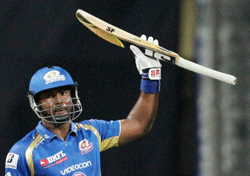 Mumbai Indians batsman D Smith celebrates his half-century against Royal Challengers Bangalore during the IPL-6 match in Mumbai on Saturday. PTI Photo