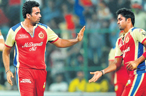 RCB's Zaheer Khan (left) celebrates with team-mate Vinay  Kumar the dismissal of CSK's Mike Hussey in Bangalore on Saturday. DH photo