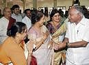 Chief Minister B S Yeddyurappa greets Parvatamma Rajkumar, actress Jayanti and Film Chamber president Jayamala at a function