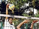 POWER-PACKED JSWs Vishwanath smashes past Sharish of ITI in the State A Division volleyball league. DH photo