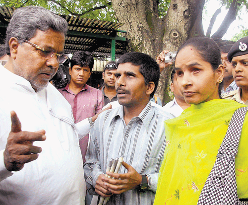 patient hearing: Chief Minister Siddaramaiah listens to the grievances of the public at the Janaspandana in Bangalore on Friday. dh Photo