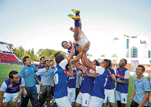 icing on the cake: Bengaluru FC players toss their captain Sunil Chhetri up in the air after he was adjudged the AIFF&#8200;Player of the Year. BFC defeated Salgaocar 2-1 at the Bangalore Football Stadium on Saturday. dh photo/ satish badiger