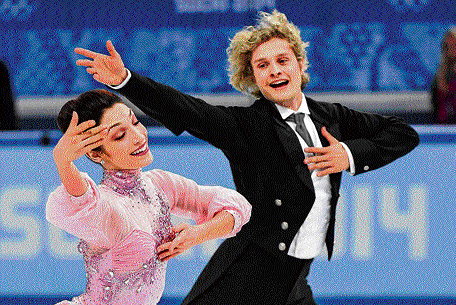 AWESOME&#8200;TWOSOME: Meryl Davis (left) and Charlie White compete in the Ice dance figure skating event at Sochi on Sunday. AP