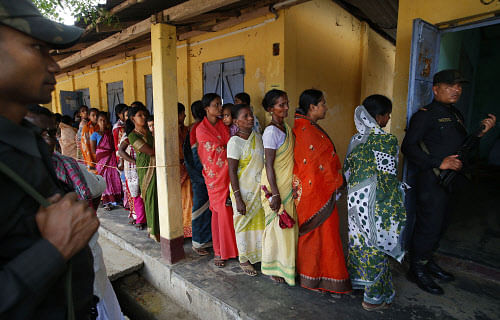 Braving inclement weather after overnight downpour, voters thronged polling booths since 6 AM, an hour before polling, to exercise their franchise in their best outfits. AP file photo