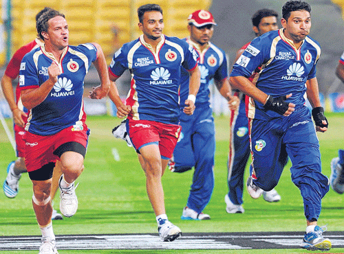 RCB's Albie Morkel (left), Harshal Patel (centre) and Yuvraj SIngh during a training session at the  M&#8200;Chinnaswamy stadium on Saturday. RCB&#8200;will take on Sunrisers Hyderabad on Sunday. DH photo