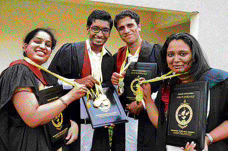 Gold medallists Anushree R, Nabeel Mustafa, Waseem Ahmed Ahanger and Pooja Hegde at the VTU's 13th convocation in Belgaum on Tuesday. DH photo