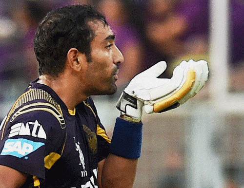 KKR batsman Robin Uthappa reacts to the crowds while returning to the pavillion during IPL 7 match against RCB at Eden Garden in Kolkata on Thursday. PTI Photo