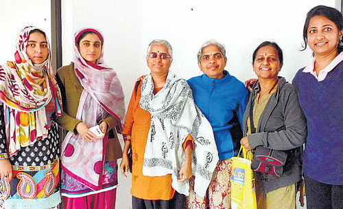 Niveditha (extreme right) and her team members from Bangalore with family members of Mohammad Yunus Bhat, who hosted them in flood-hit Srinagar.