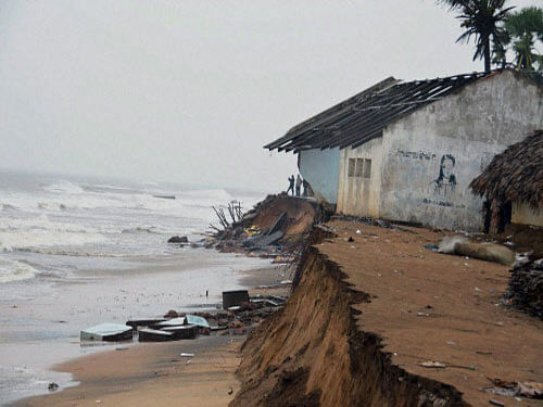 A day after Cyclone Hudhud devastated Visakhapatnam and other nearby districts, the state government today embarked on the gigantic task of restoring normalcy in the battered port city and providing access to affected villages. PTI photo