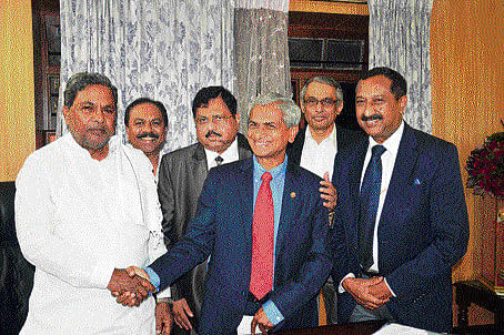 Karnataka Chief Minister Siddaramaiah meets a FKCCI delegation in Bangalore on Friday.