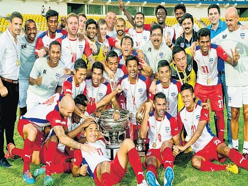 what a start!: The victorious Bengaluru FC squad poses with the Federation Cup after their 2-1 win over Dempo SC in the  final at the Jawaharlal Nehru Stadium in Margao on Sunday. photo courtesy/ BFC