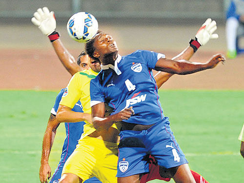 IN Sync: Bengaluru FC's Curtis Osano tries to head the ball during their AFC Cup match against Maziya in Bengaluru on Tuesday. dh photo/ srikanta  Sharma R