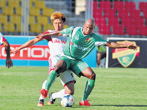 IT'SMYBALL Djidjia Douhou (foreground) of Salgaocarmoves past Lajong's Milan Singh in their I-League clash in Margao on Tuesday. Salgaocarwon the match 2-1. PTI