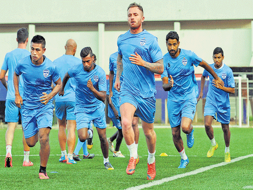 RARING TO GO Bengaluru FC players train on the eve of their AFC Cup clash against Singapore'sWarriors FC on Monday. DH photo/ SATISH BADIGER