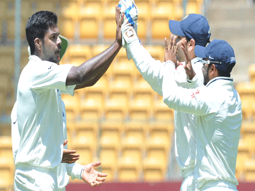 Rest Of India's varun Aaron celebrates with his teammets the CBW dismissial of Karnataka's Mayank Agarwal on the 1st day play of the Irani Trophy Cricket match in the 1st innings at Chinnaswamy Stadium in Bengaluru on Tuesday.  DH Photo.