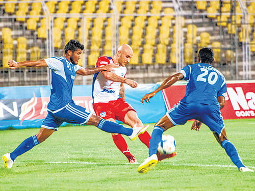 no way through: Bengaluru FC's Sean Rooney (centre) tries to score past the Dempo SC defence on Saturday. bfc media