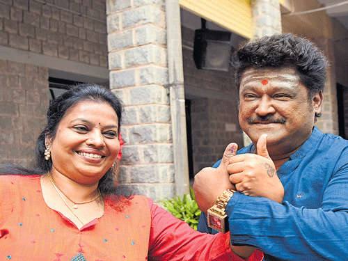 Actor Jaggesh and his wife Parimala appear elated after exercising their franchise. DH photo