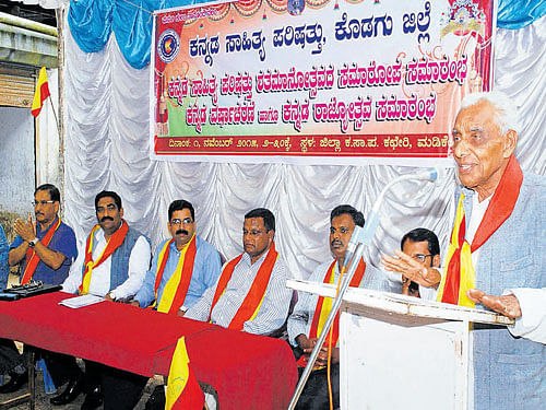 Writer Neerkaje Mahabaleshwara Bhat speaks at the centenary celebration programme of the Kannada Sahitya Parishat organised by the district unit in Madikeri recently. DH photo